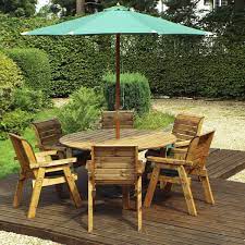 Charles Taylor 6 Seater Round Table Set With Cushions Storage Bag Parasol And Base Robert Dyas Round Dining Set Garden Furniture Sets Outdoor Dining Set