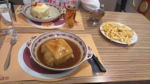 Every great city needs a great sandwich. The Francesinha Sandwich One With Fried Egg And Sauce On The Side Picture Of Santa Francesinha Porto Tripadvisor