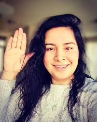 I am Denis Ramirez-Rosales Co-founder of Dulce Nostalgia, I raise my hand  to celebrate International Women's Day. On this International Women's Day,  I stand up with Smile Train as we #Choose to