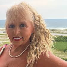 Which laminate floor would look best? The marble looking is what the wall  of the shower looks like. It's in a small bathroom. Walls are currently  white.