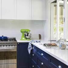 Amazing gallery of interior design and decorating ideas of white upper cabinets and blue lower cabinets in living rooms, laundry/mudrooms, kitchens by elite interior designers. White Upper Cabinets Navy Blue Lower Cabinets Design Ideas