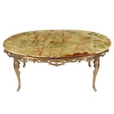 The most common rococo coffee table material is metal. 1960s Rococo Style Onyx Coffee Table Vintique