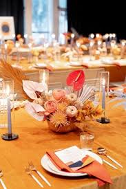 The secret to this stunning tabletop? Orange Wedding Centerpieces