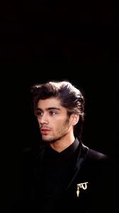 Zayn Malik At The Bbc Music Awards Sporting His Iconic Hairstyle, Captured  As An Appealing Iphone Wallpaper. Wallpaper