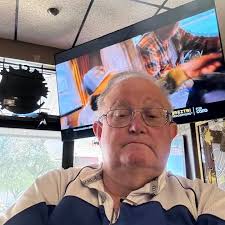 1975 photo showing Raiders defenders Otis Sistrunk (60), George Atkinson  (43) and Jack Tatum take a break during a 25-0 win over the Chargers.