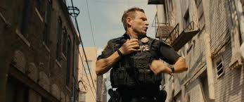 A cop finds himself in a race against time to find a kidnap victim whose abductor he accidentally killed. In The Line Of Duty Review Brazen Absurdity Film Review By Nick Hasted