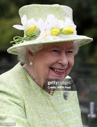 Keeper Maia Gordon with Olive the duck after Queen Elizabeth II... News  Photo