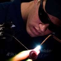 Hull Maintenance Technician Jake Sadlowsky, from Abingeon, Il., brazes a  low pressure air line valve fitting.