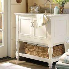 A good bathroom vanity should have storage space to conceal necessities, plumbing, and sleek countertops to make getting ready even easier. How To Build A Bathroom Vanity Inspired By Pottery Barn Tip Junkie