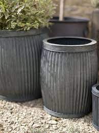 10 Easy Pieces Zinc Barrel Planters Gardenista Zinc Planters Barrel Planter Plants For Small Gardens