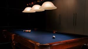 To make the most of your square footage, hang a small shelf or picture ledge along an open wall and pull up a few bar stools to give everyone a place to perch. Indoor Games Room Interior Design Ideas Bizzoppo