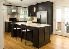 With lots of natural light, white cabinets, and a light color palette for the tile backsplash, the white oak helps amplify the bright, airy feel of the kitchen. 52 Dark Kitchens With Dark Wood Or Black Kitchen Cabinets 2021 Black Kitchen Cabinets Hardwood Floors In Kitchen Kitchen Design Small