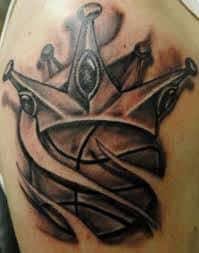 Black and grey crown with basketball tattoo on right shoulder. What Does Basketball Tattoo Mean Represent Symbolism