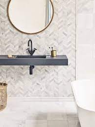 These mosaic tiles are made of luxurious calacatta gold marble, featuring an ivory hue with natural warm color variations. East Haven Chevron Mosaic Wall And Floor Tiles Chevron Tiles Bathroom Marble Bathroom