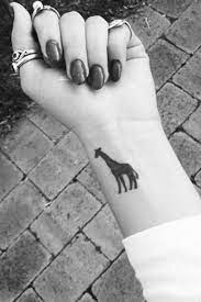 30 Small Tattoos Every Girl Will Love Giraffe Tattoos Small Giraffe Tattoo Small Tattoos