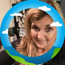 Who is a good hair stylist in Ludington for growing out bangs and gray hair?