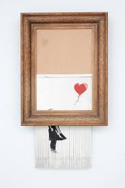 Banksy shocked the art work last october when his 2006 painting slid into a shredder hidden inside its frame just seconds after selling at auction for £1.04 million ($1.4 million). Winning Bidder For Shredded Banksy Painting Says She Ll Keep It The New York Times
