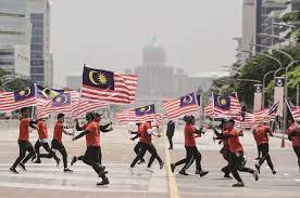The singapore national day parade is a national ceremony that is usually held at the float @ marina bay, the national stadium at the singapore sports hub, or the padang.in 2007, the parade was held at the float @ marina bay for the first time, and in 2016, it was held at the singapore sports hub. 2020 S Merdeka Day Parade Is Canceled Trp