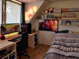 Would You Want A Bedroom Like This Plenty Of Manga A Badass Gaming Setup And A Widescreen Tv All Within Reach Bedroom Setup Room Setup Game Room Design