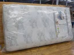 A Serta Perfect Balance Deluxe Firm Crib And Toddler Mattress In Grey