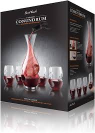 The box has been opened. 5 Piece L Grand Conundrum Sets Decant