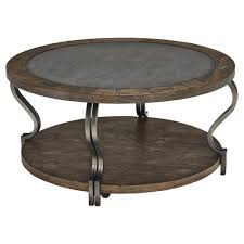 Signature Design By Ashley Volanta Cocktail Table The Ruggedly Transitional Coffee Table Round Wood Cocktail Table Ashley Furniture