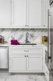 Renovated kitchen interior with white cabinets. Off White Kitchen Cabinets Design Ideas