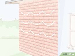Along the fence or a wall, around a tree, or up the side of your house (we'll leave that bit up to you!) 3 Easy Ways To Hang Christmas Lights On Brick Wikihow