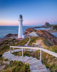 Walkway To The Castlepoint Lighthouse At Sunrise Wellington Region North Island New Zealand By Lau Beautiful Lighthouse Lighthouse Lighthouse Pictures