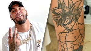 Goku dragon balls cartoon shows dragon ball super manga pokemon art gohan ssj2 dragon ball artwork dragon small dragon tattoos. Watch Anuel Aa Breaks Down His Tattoos Tattoo Tour Gq