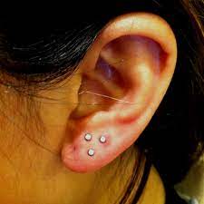 Triple Triangle Lobe Piercing By Stacey Ear Lobe Piercings Needle Earrings Ear Piercings