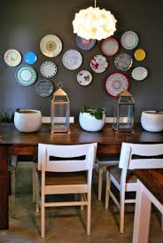 To break up lots of little squares, add in a plate. Decorating With Plates Using Dinner Plates To Decorate Your Walls Dengarden Home And Garden