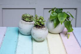 Scoop concrete into a large mold and set a second, smaller mold into the first one. How To Make Easy Cement Orb Planters At Charlotte S House