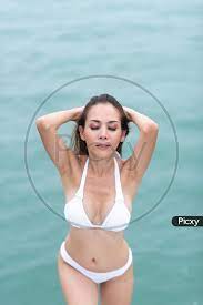 Image of Asian Girl Wearing White Bikini and Enjoying Yacht  trip-TW397841-Picxy