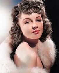 Color portrait of Frances Gifford, star of JUNGLE GIRL serial....