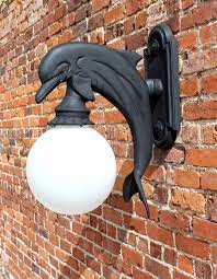 This outdoor barn light wall fixture enhances the beauty of your property makes your home safer and more secure and increases the number of pleasurable hours you spend outdoors. Dolphin Wall Mount Sconce Indoor Or Outdoor Light Nautical Sea Fixture The Kings Bay