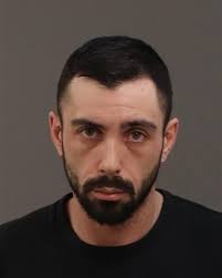 Suspect identified, officer still hospitalized after crash in Warren