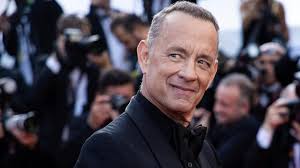 Mit spørgsmål får Tom Hanks til at reagere. Det er tydeligt, at jeg får  trykket på en knap hos ham