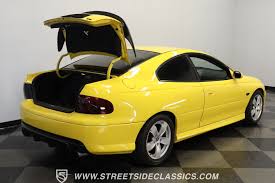 Image result for Yellow 2004 Pontiac