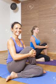 What are some yoga exercises. An Image Of Some People Doing Yoga Exercises Stock Photo Picture And Royalty Free Image Image 21774078