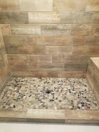 Wood Tile Shower Walls With River Rock Floor In Finished Basement Bathroom Wood Tile Shower Basement Bathroom Bathroom Remodel Shower