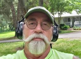 What is the estimated value difference between chrome and plastic bumper  Corvette models?