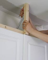 The space above the kitchen wall cabinets can be left open for storage, closed off with a kitchen soffit, or filled in with an extended kitchen soffit. How To Enclose The Space Above Kitchen Cabinets Angela Marie Made