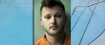 Former Navy rescue swimmer accused of trying to drown security guard in pool