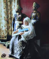This was done to mark the big lunch at the eden project. Queen Victoria Seated With Her Two Indian Servants Mustafa And Chidda Standing Behind Her In Full Uniform With Medals Colorization