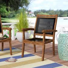 Tovar Sling And Eucalyptus Stackable Arm Chair Wood Patio Chairs Patio Chairs Outdoor Patio Chairs