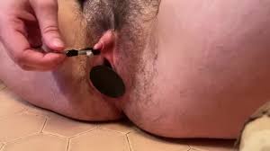 Nipple clamp on Tdick and huge plug under clothes