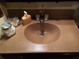 I found a tutorial on pinterest from the bright green door blog on how to spray paint counter tops and i loved her end result! After Picture Of The Spray Painted Sink And Countertop I Didn T Have The Money To Replace Th Diy Bath Products Basement Makeover Basement Makeover On A Budget