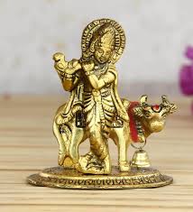 Krishna is famous for playing the flute. Buy Ecraftindia Lord Krishna Playing Flute With Golden Cow Showpiece Online Krishna Religious Idols Home Decor Pepperfry Product