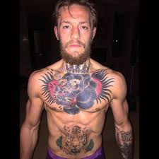 A lot of people get tattoos with stories behind them; Conor Mcgregor Chest Tattoo Is Badass Fighting Tattoo Chest Tattoo Chest Tattoo Men